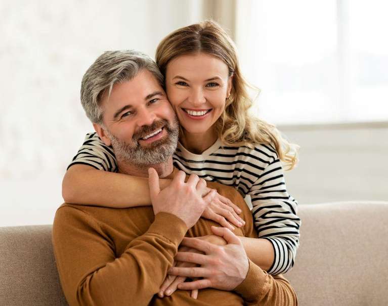 before and after all-on-4 dental implants | couple smiling