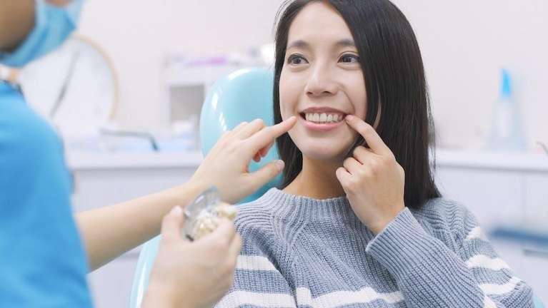 patient discussing tooth replacement options in East Hills
