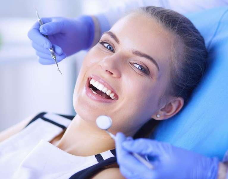 dentist east hills | woman at dentist